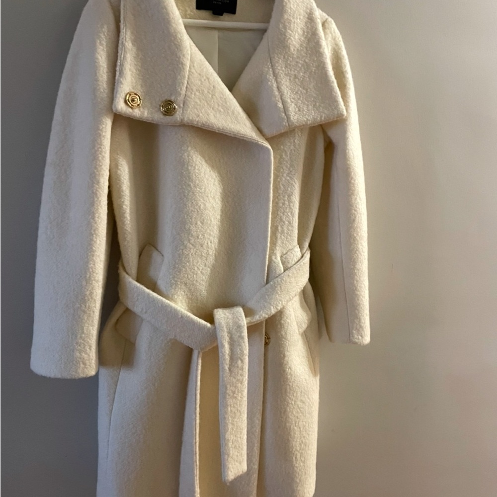 Creamy White Trench Coat with Oversized Lapel and Belted Closure